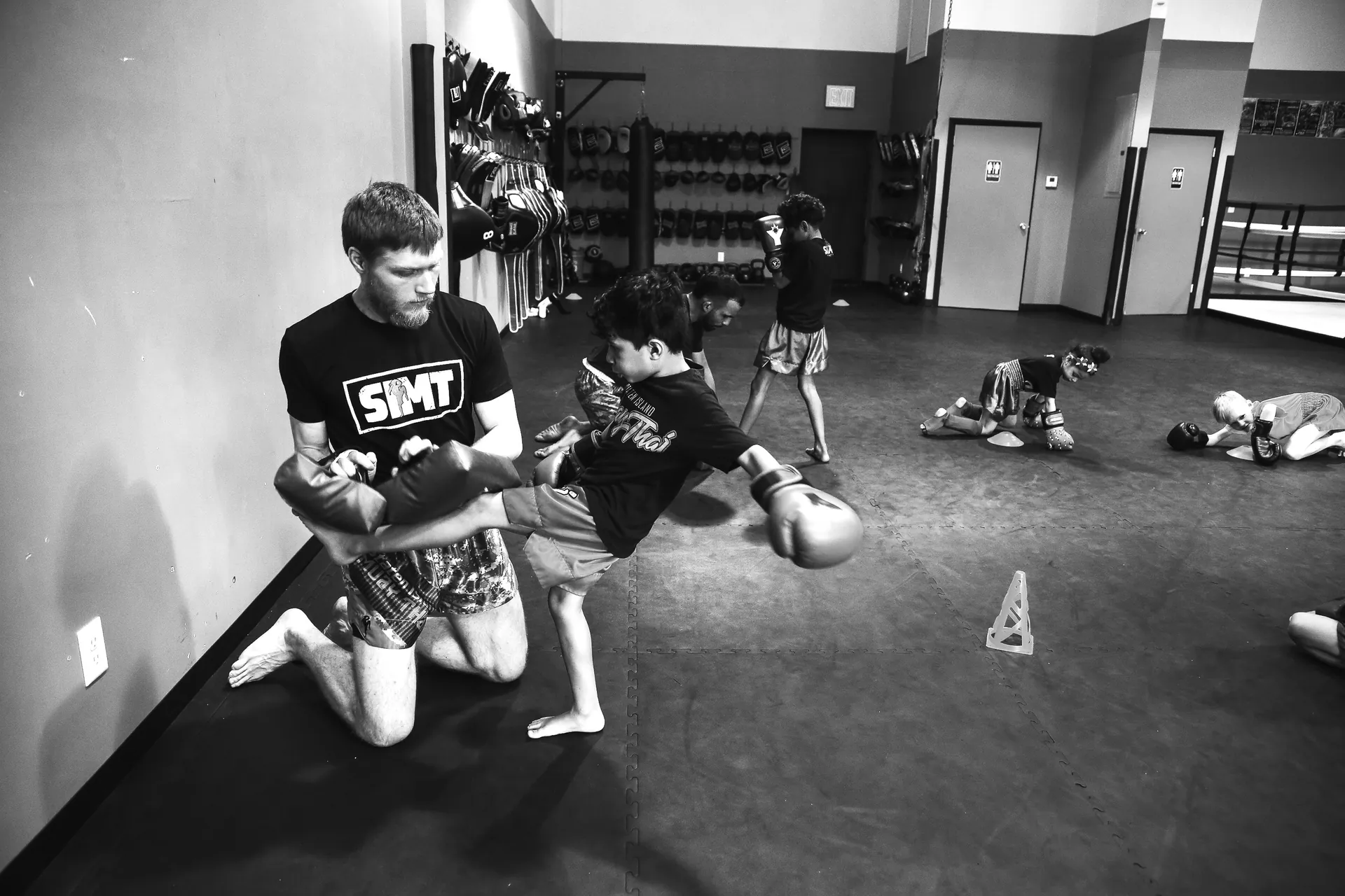 Young students learning Muay Thai fundamentals in youth program