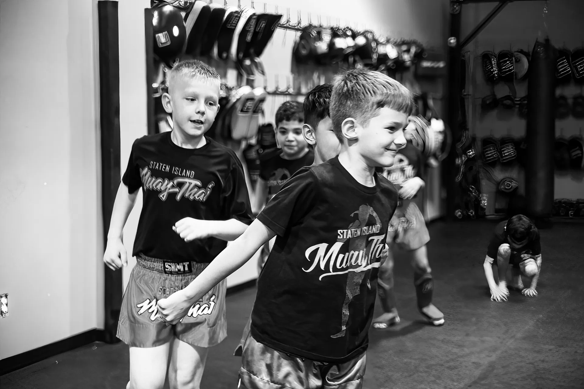 Youth martial arts class practicing techniques at Legion Muay Thai