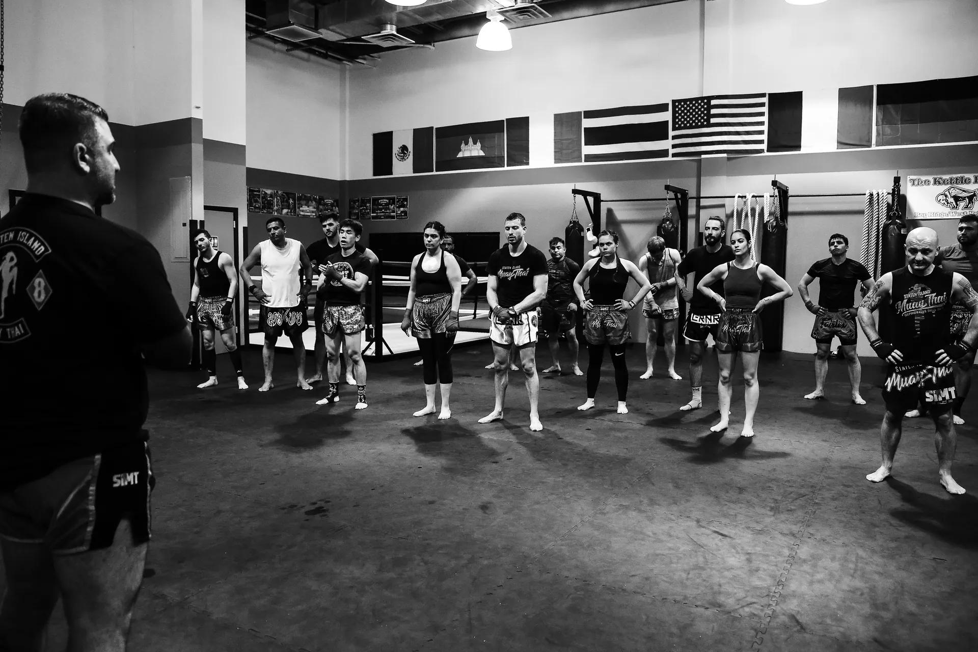 Group training class demonstrating Muay Thai clinch techniques