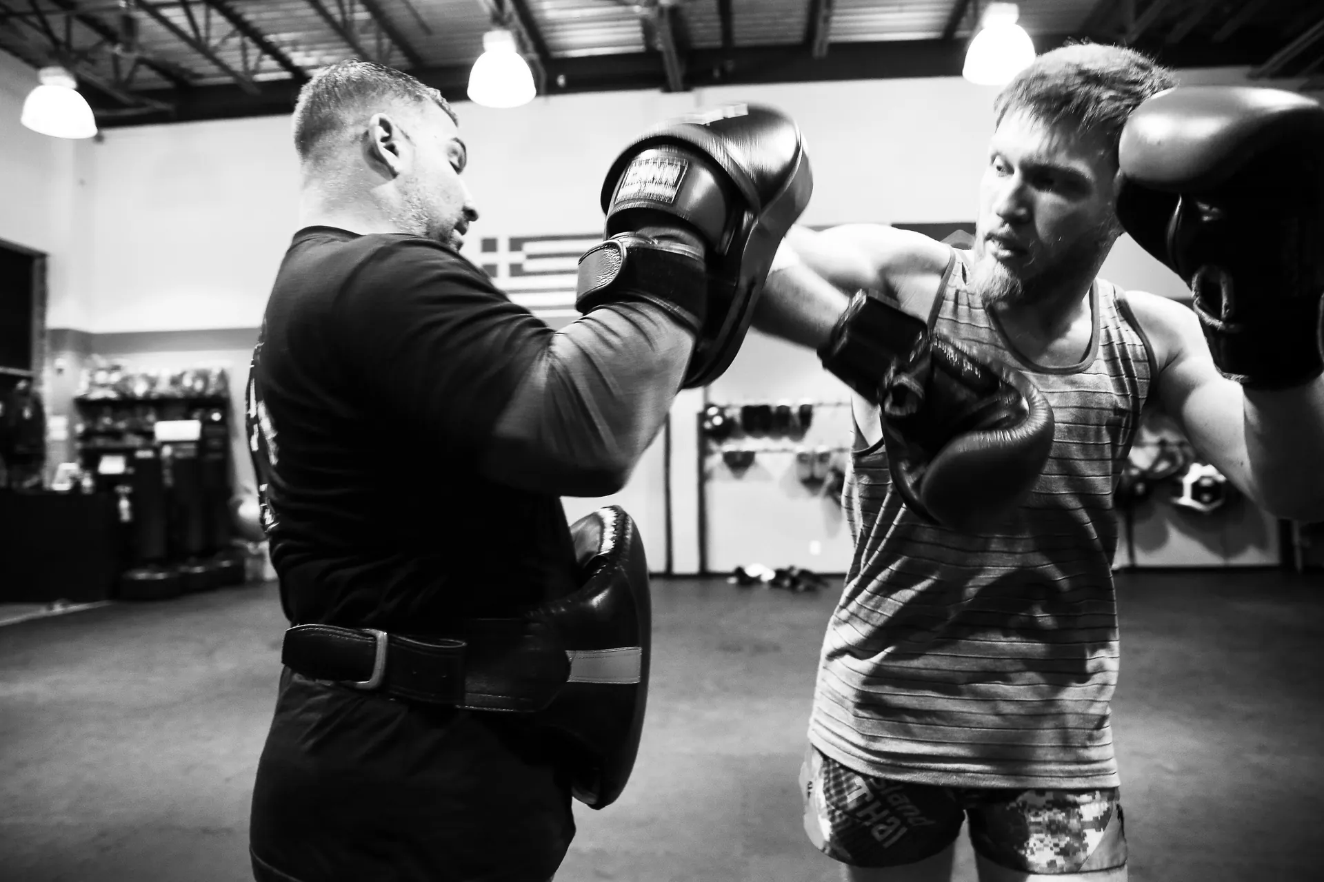 Muay Thai students practicing defensive techniques and counters
